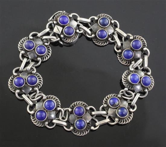 A Danish Georg Jensen sterling silver and lapis lazuli set bracelet, no. 8, 1915-1927 mark, 18.3cm.